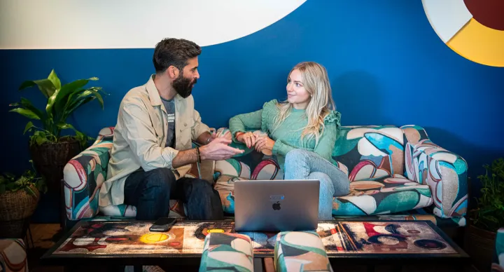 a man talking to a woman