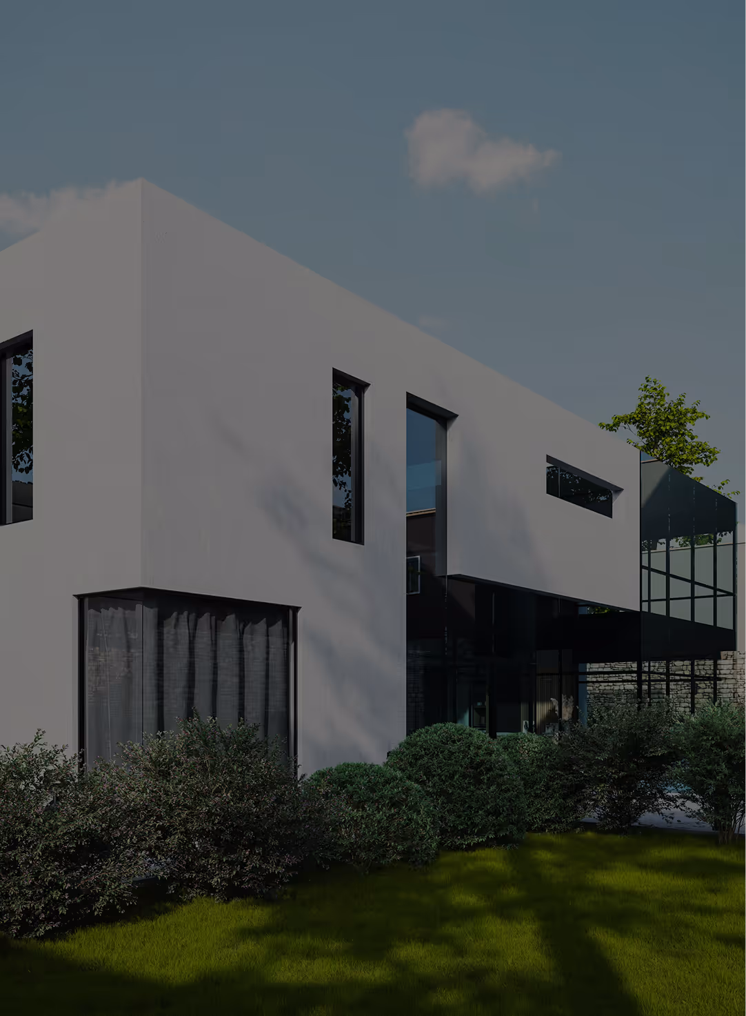 Modern two-story house with white walls, large windows, and surrounding green bushes under a clear sky.