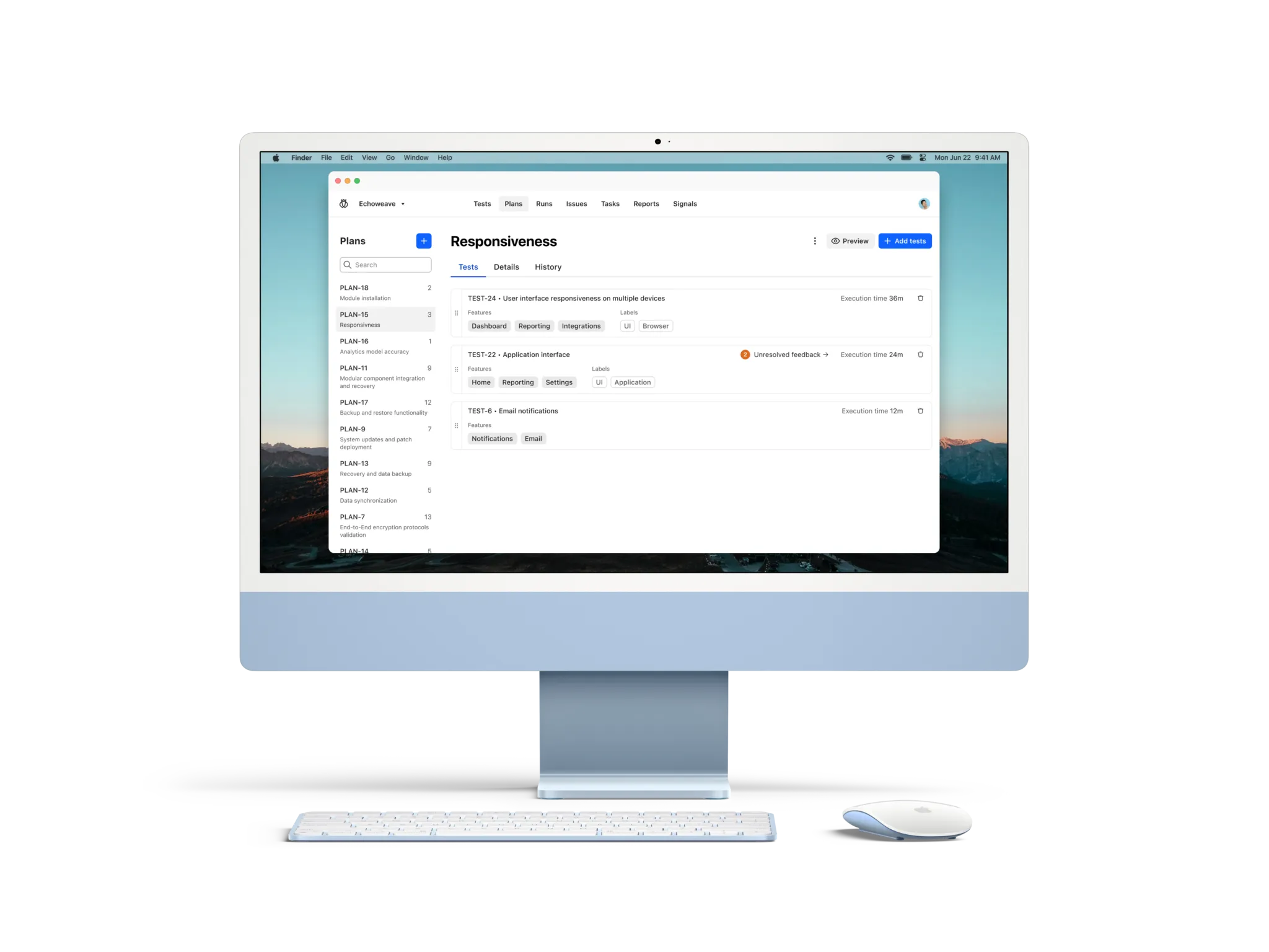 Light blue iMac with keyboard and mouse displaying a software interface focused on test plans and responsiveness features.
