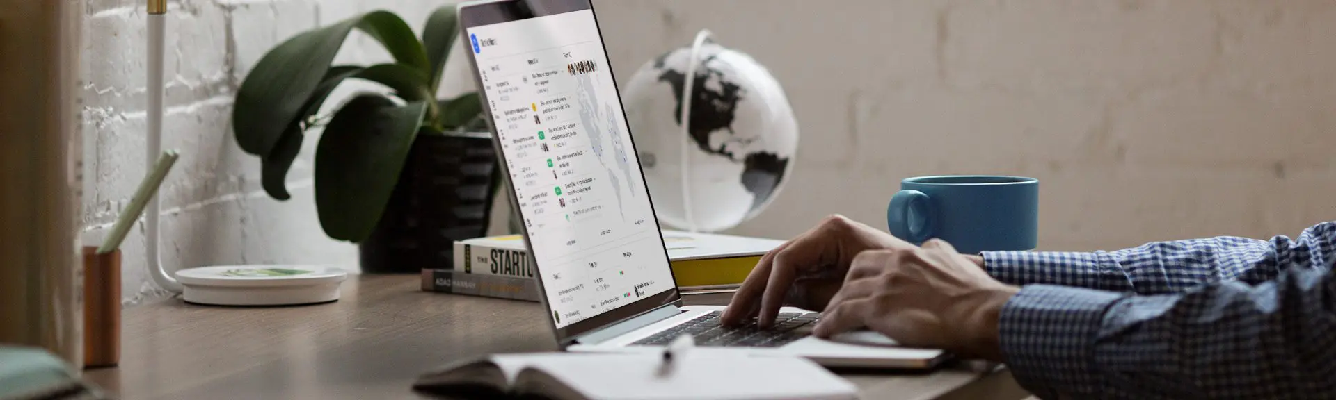 Photo of a man using a laptop