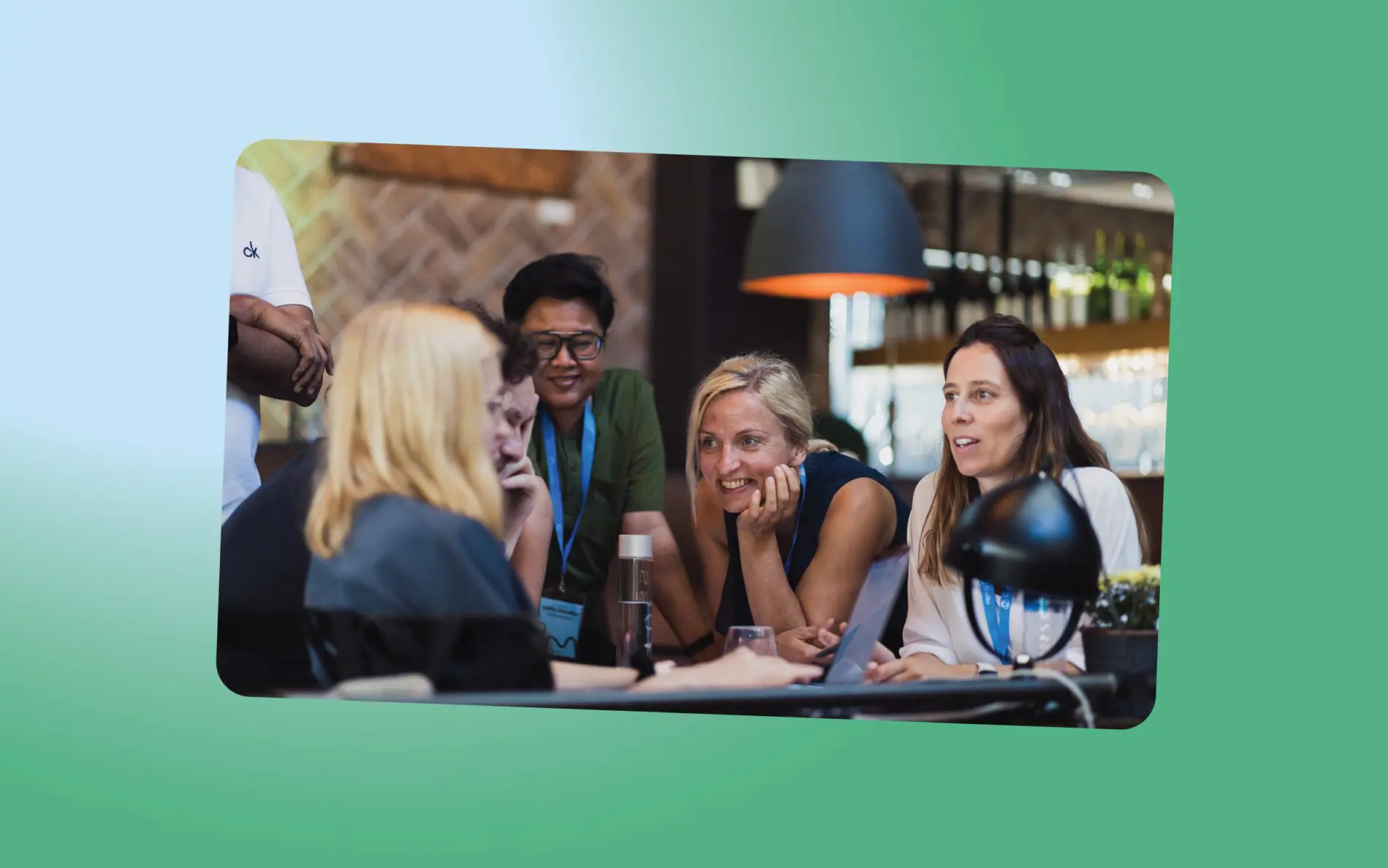 People are gathered around the table, discussing something