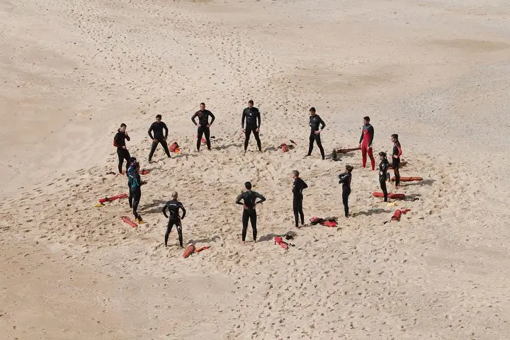 People in a circle on the beach