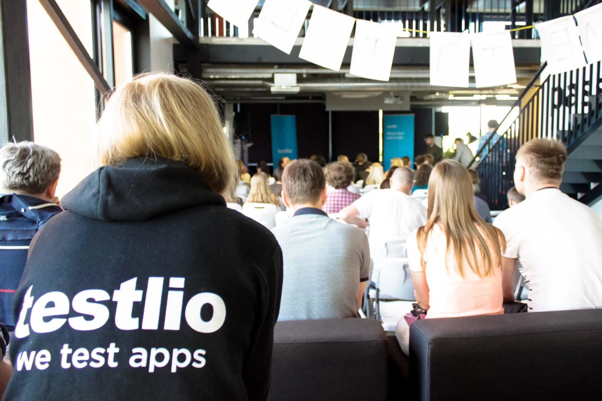 A photo of people during a presentation