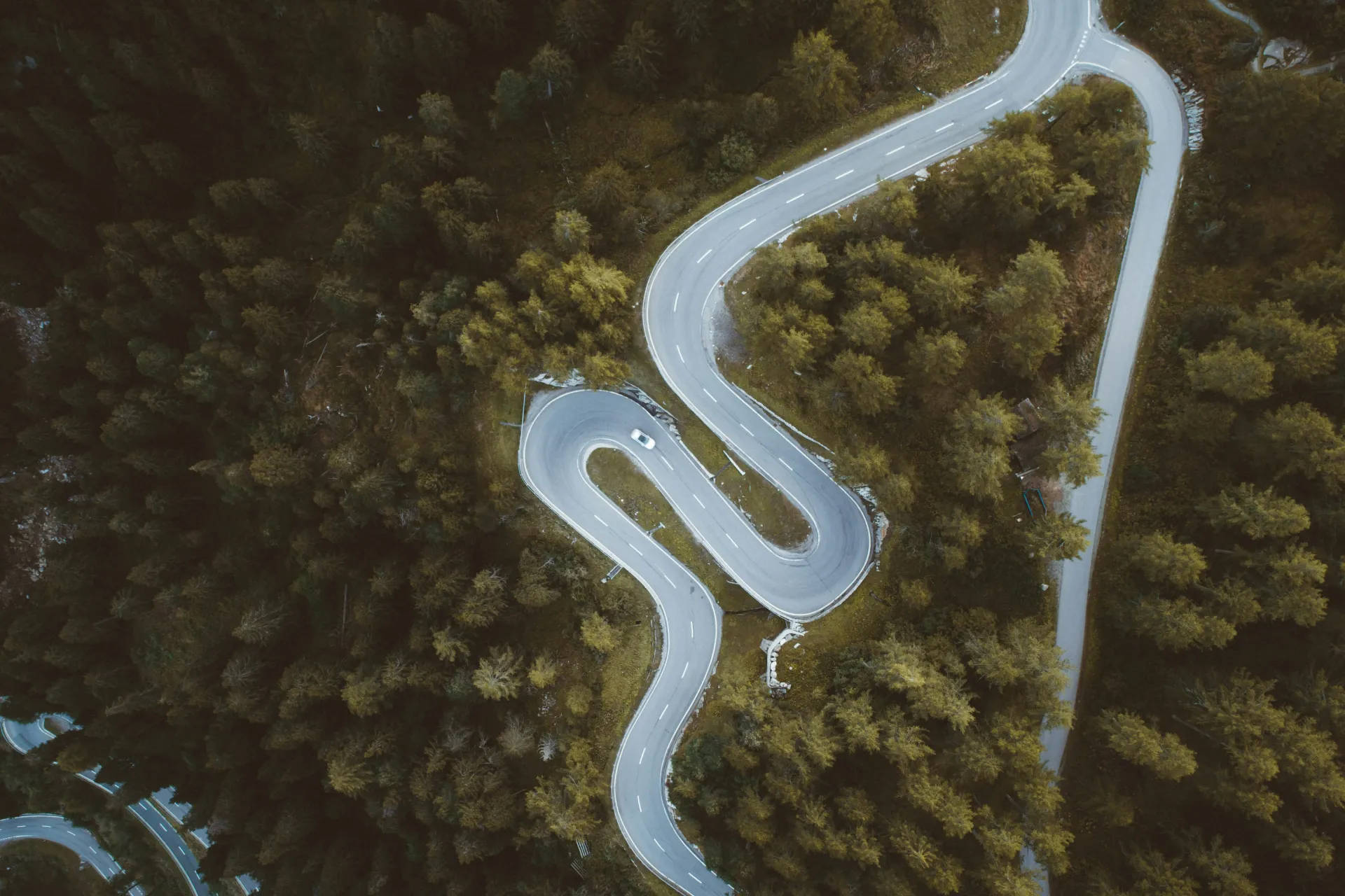 QA Testing Best practices Blog - Shows Wining Road in Summer Surrounded by Green Trees