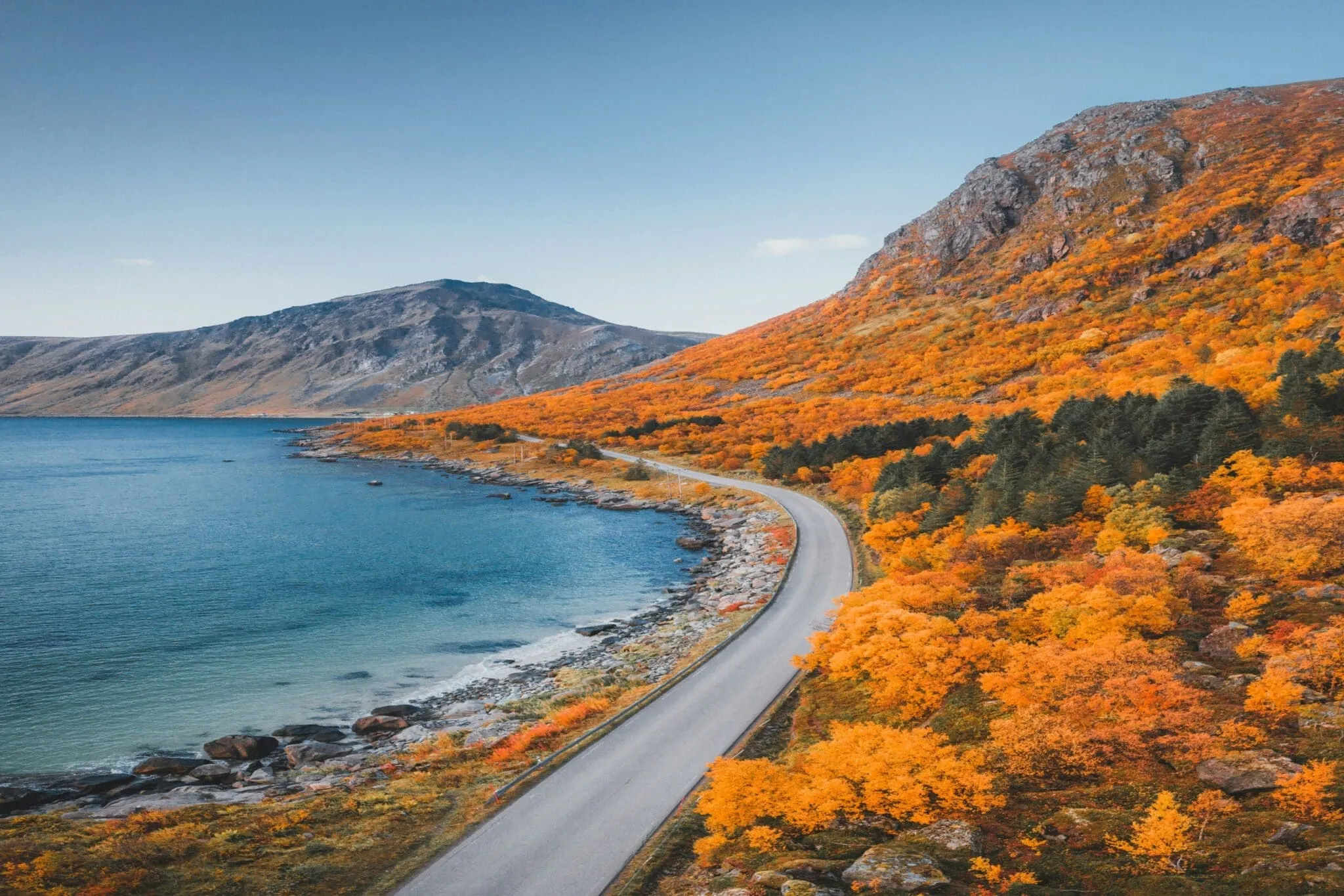 Shift-Left Blog Header: Show cases orange foliage running alongside a curved road and a river|Shift-left blog: The cost of defects graph shows how bugs caught later in the development stages can cost 30-100x more.|Developers find an increased cognitive load, an aversion to change and ineffective feedback as drawbacks to shift-left testing.|Overcoming challenges in shift left testing requires prioritizing DevEx, outsourcing or crowdsourcing, designing seamless processes, providing actionable feedback and selective shift-left.