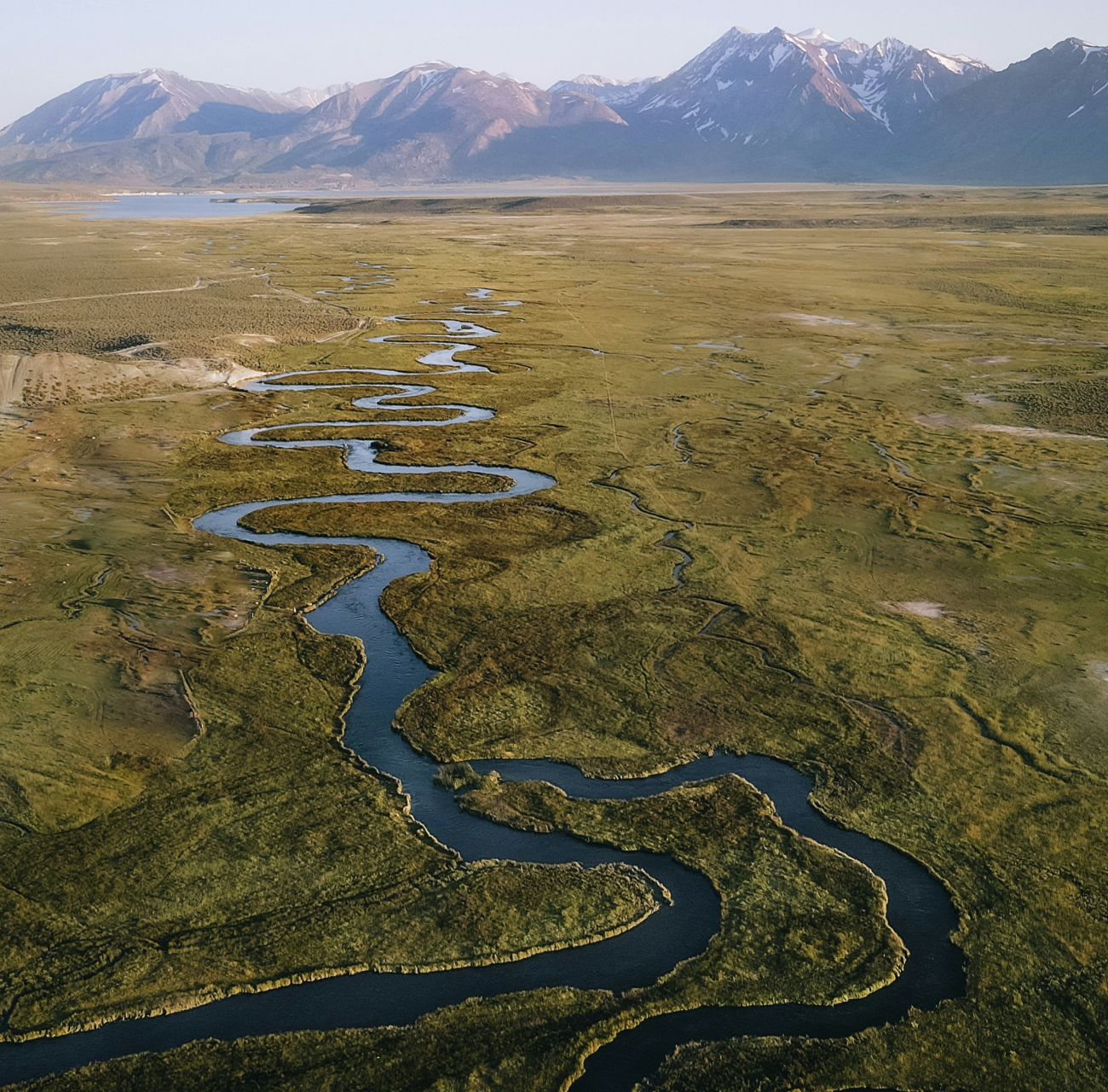 Automated Testing Strategy Blog Header - Shows mountains in the background and a river running through a fieldTest automation strategySmart automated testing strategy