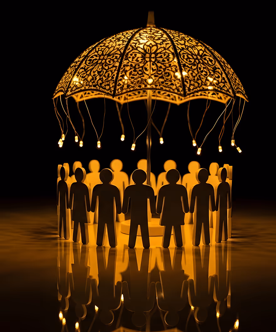 Illustration of paper cutout people figures holding hands in a circle under an ornate illuminated umbrella with hanging lights.