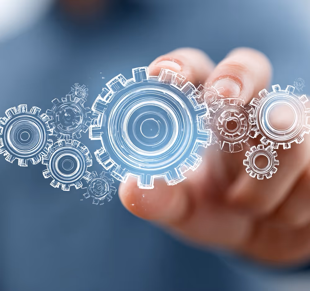 Hand interacting with floating transparent digital gears on a blue background.