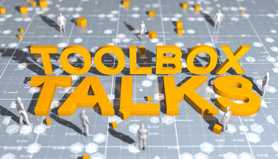 3D large yellow text reading 'TOOLBOX TALKS' on a digital grid background with small white figurines and scattered yellow cubes.