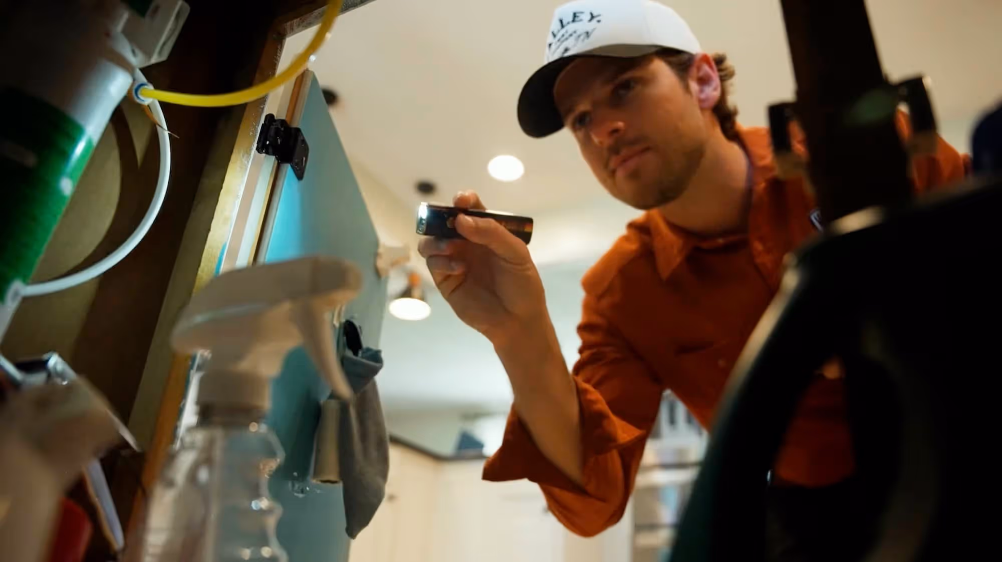 residential pest control technician looking for signs of infestation in Sevierville Tennessee