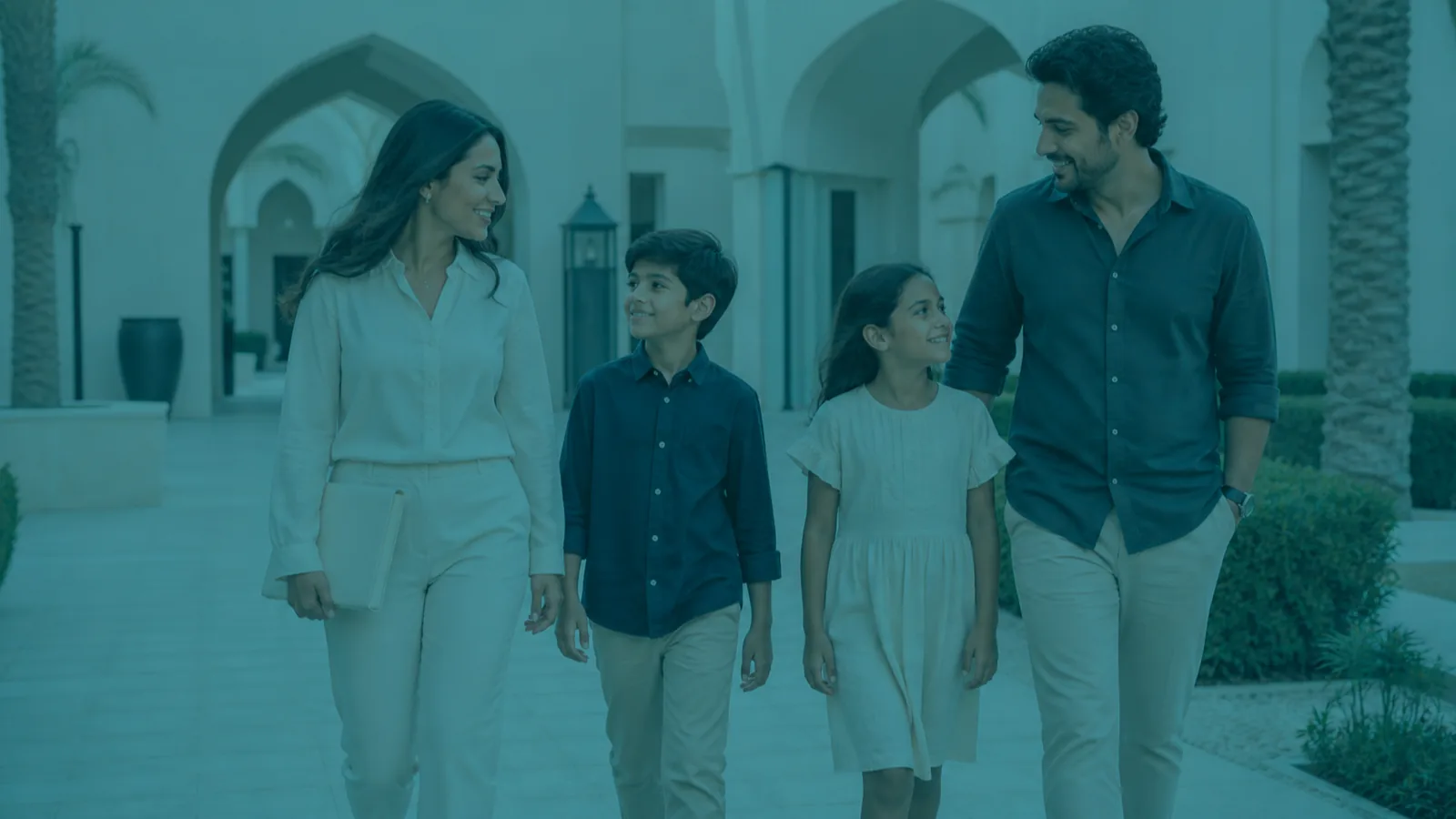 Family in a UAE residential courtyard, family residence visa sponsorship
