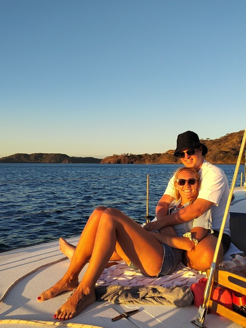 [headshot] image of satisfied student using a laptop, with emphasis on organic forms and material interplay