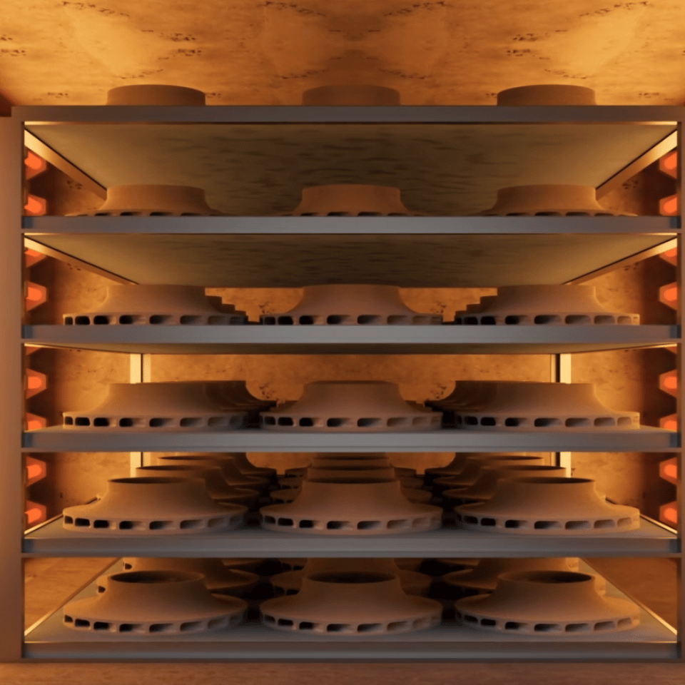 Green parts being being sintered inside a furnace