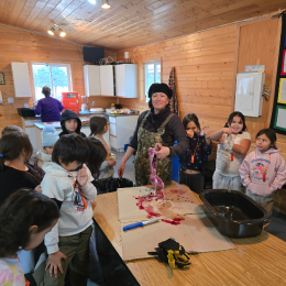 A workshop showing children how to harvest an animal