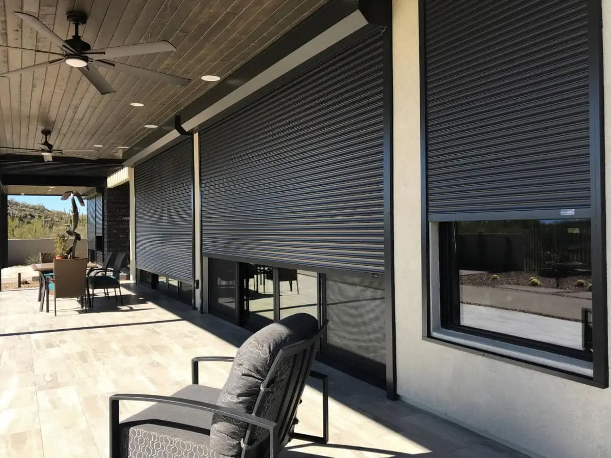 Closed rolling shutters on a patio.