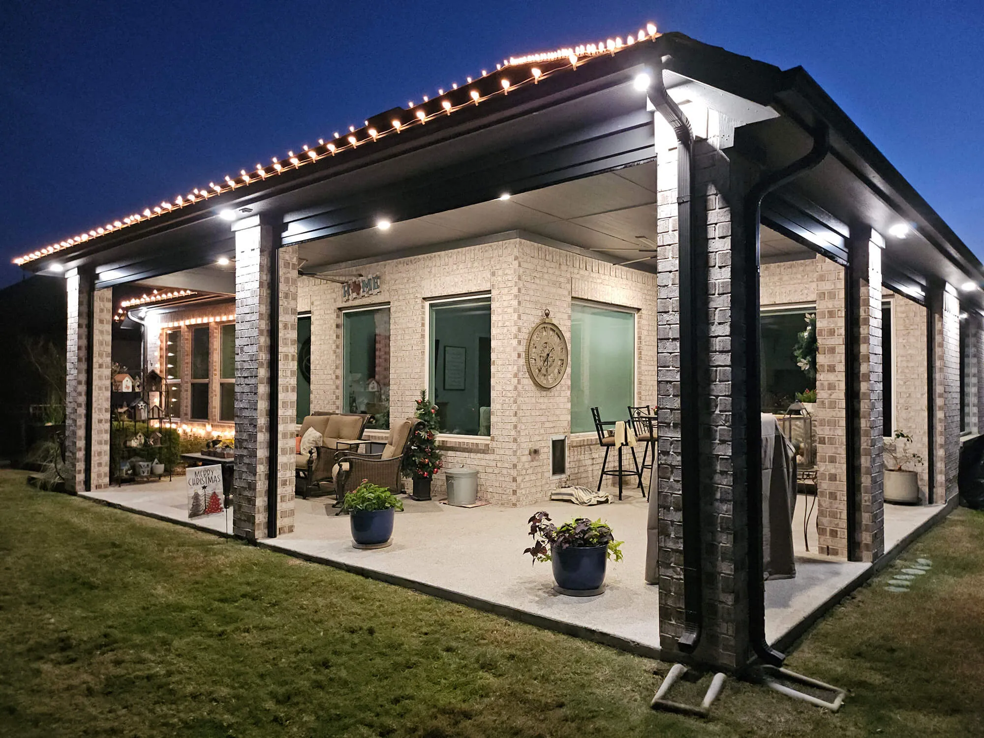 Modern patio with lights at dusk.