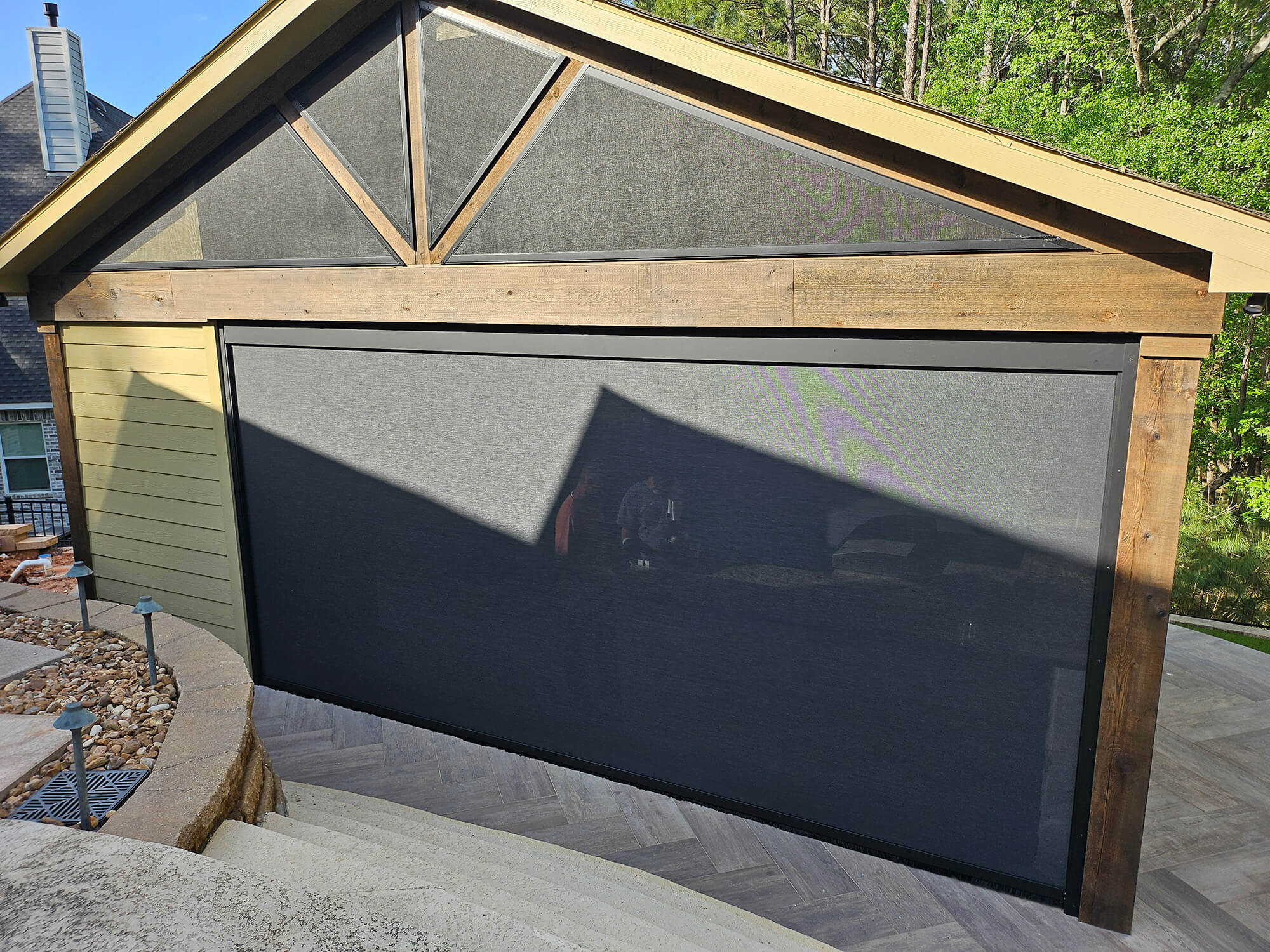 Large retractable screen on a home patio.
