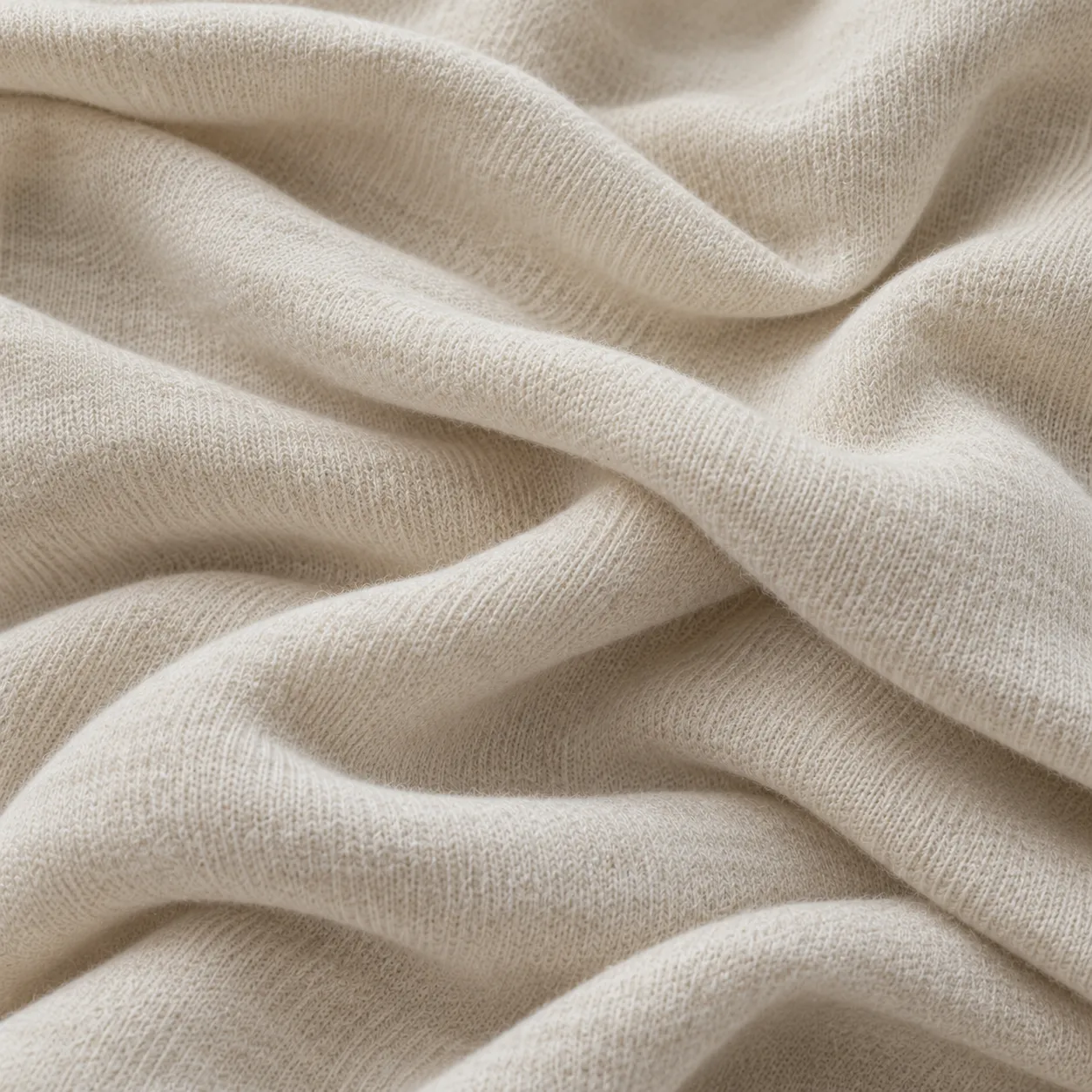 Close-up of warm ivory fine cotton knit