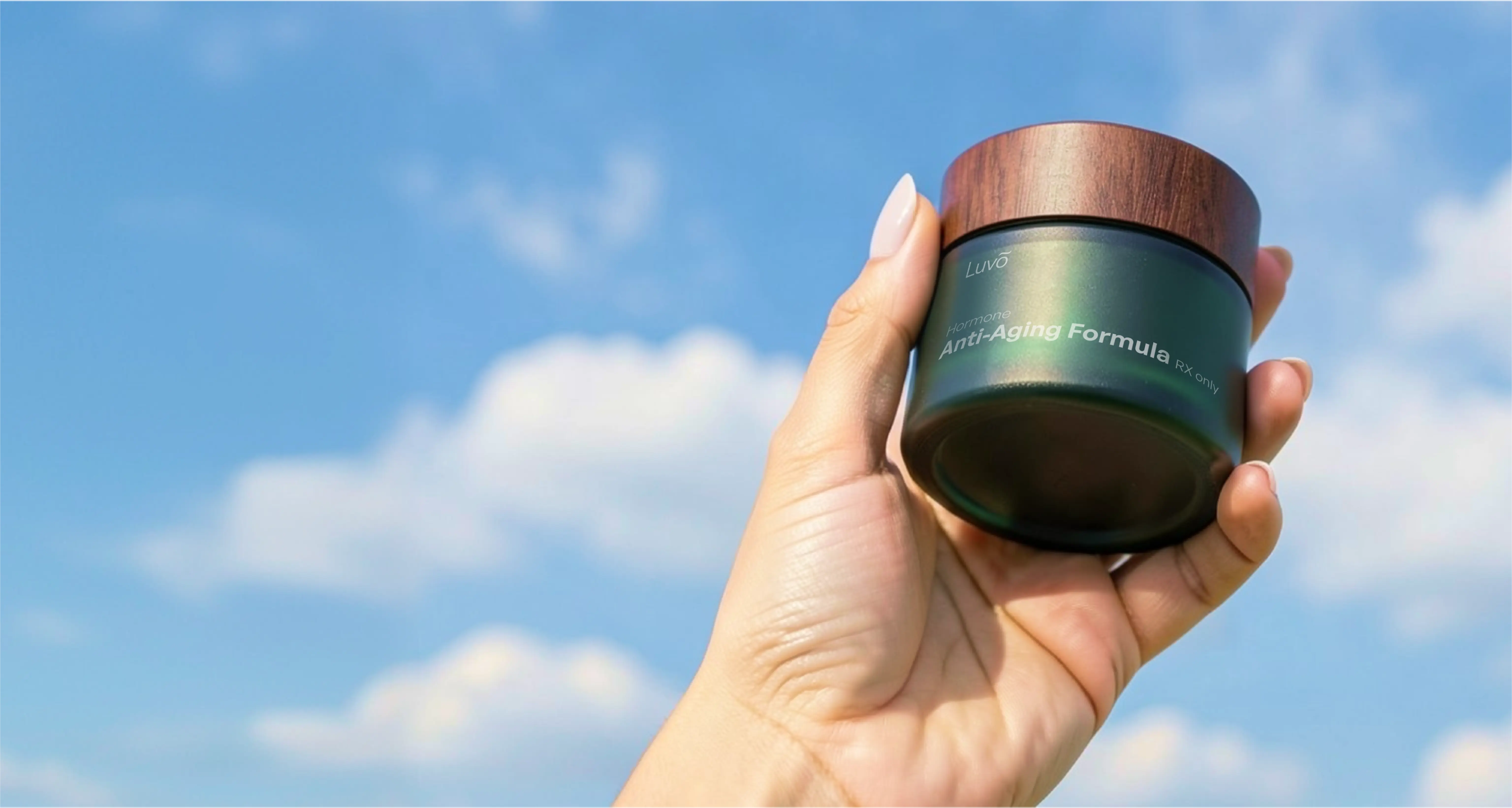 Person holding skincare cream