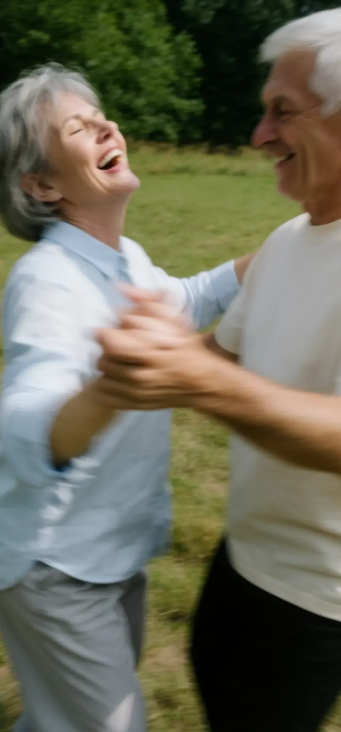 Older couple laughing and dancing together outdoors