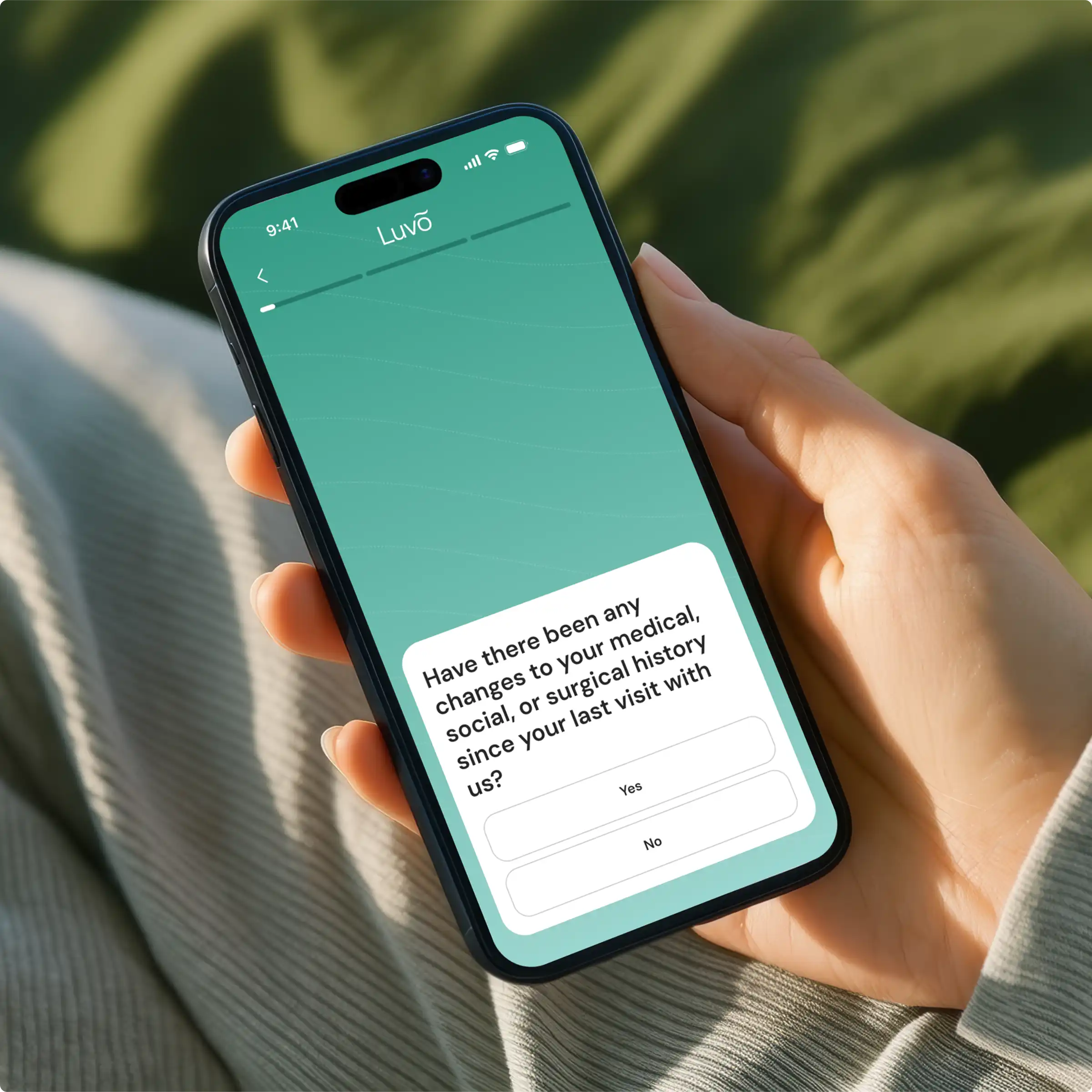 Person completing a Luvo medical intake on a smartphone