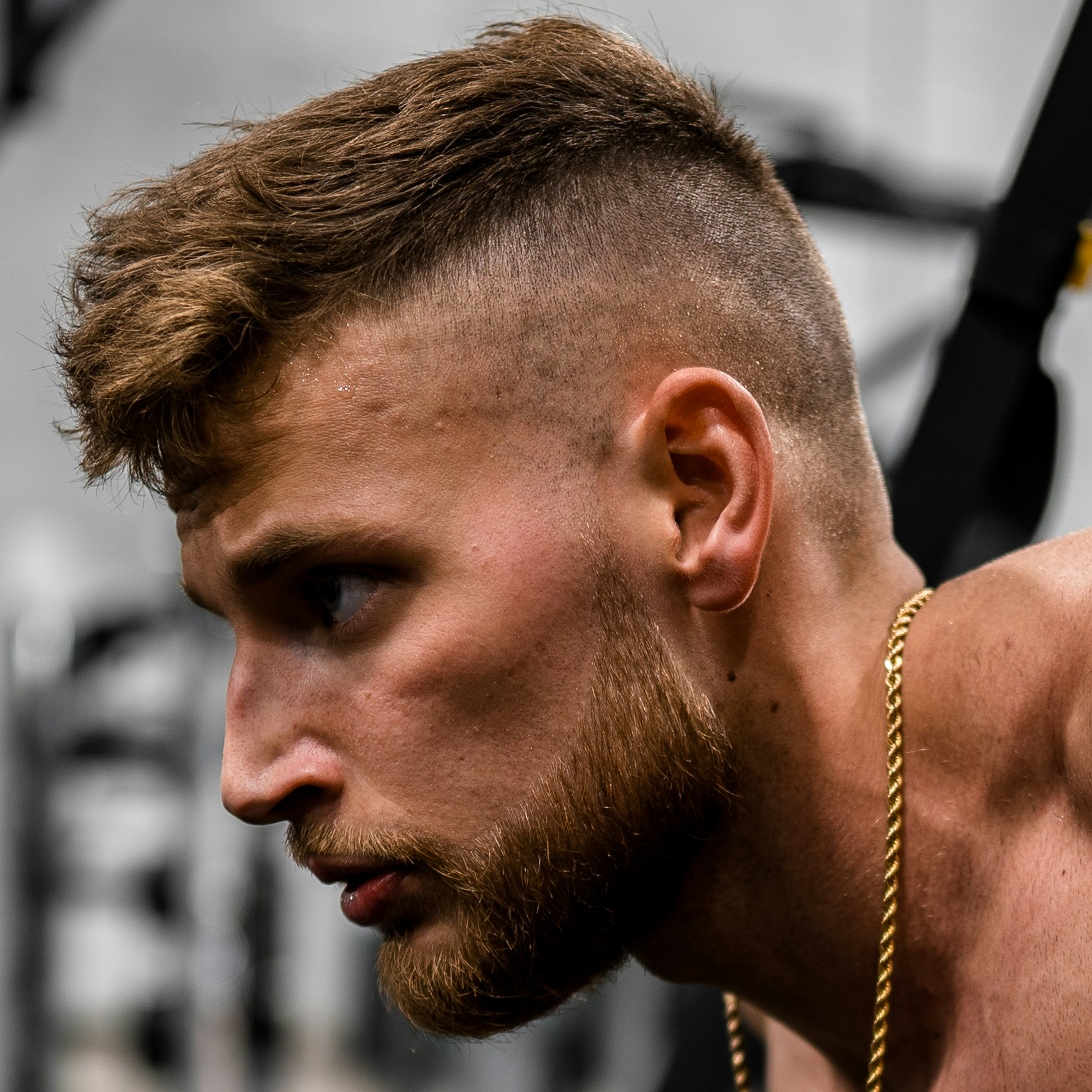 Avatar photo of a man lifting weights