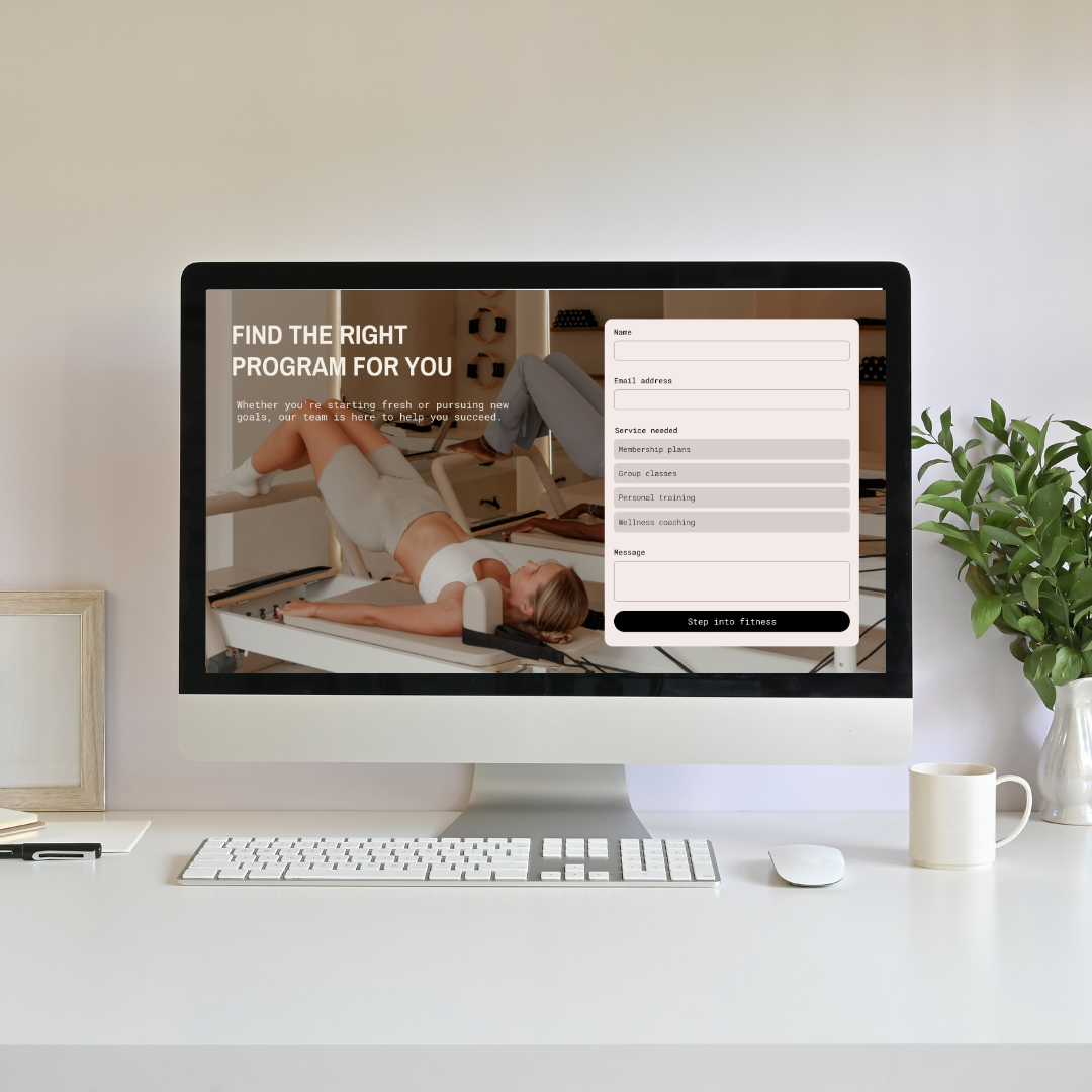 contact form of pilates studio website on a desktop with white desk and walls