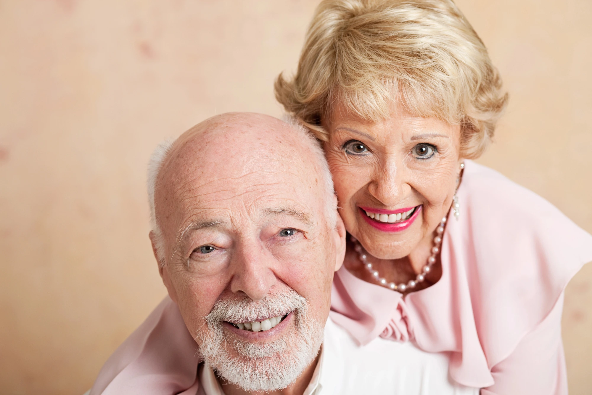 older couple smiling after getting Dentures in Louisa