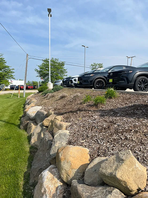 A commercial outdoor space after Turf and Tree Worx showcasing custom design landscape services 