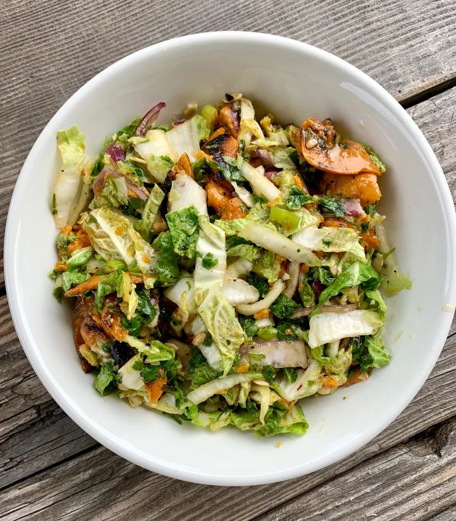 Roasted potato and green cabbage salad with scallions and celery