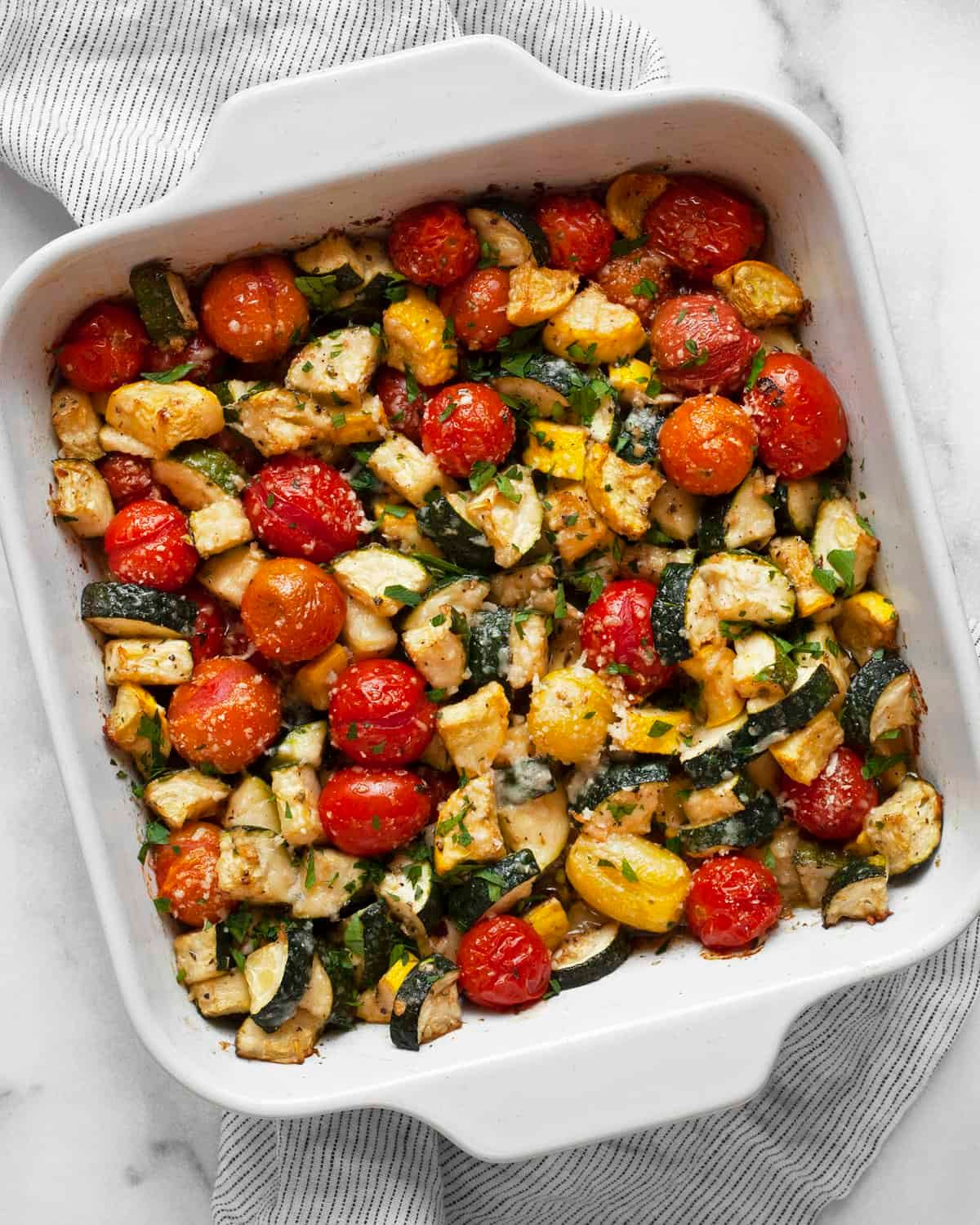 Roasted zucchini, cherry tomatoes, and new potatoes with fresh basil ribbons