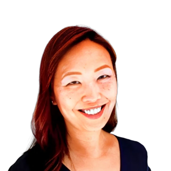 Portrait of a smiling woman with dark hair wearing a black top against a white background.
