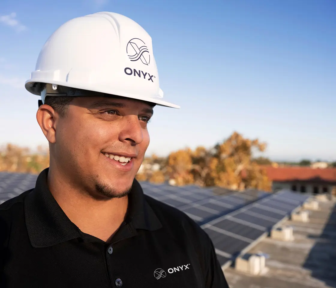 An Onyx employee overseeing a commercial solar system for ongoing performance and reliability.