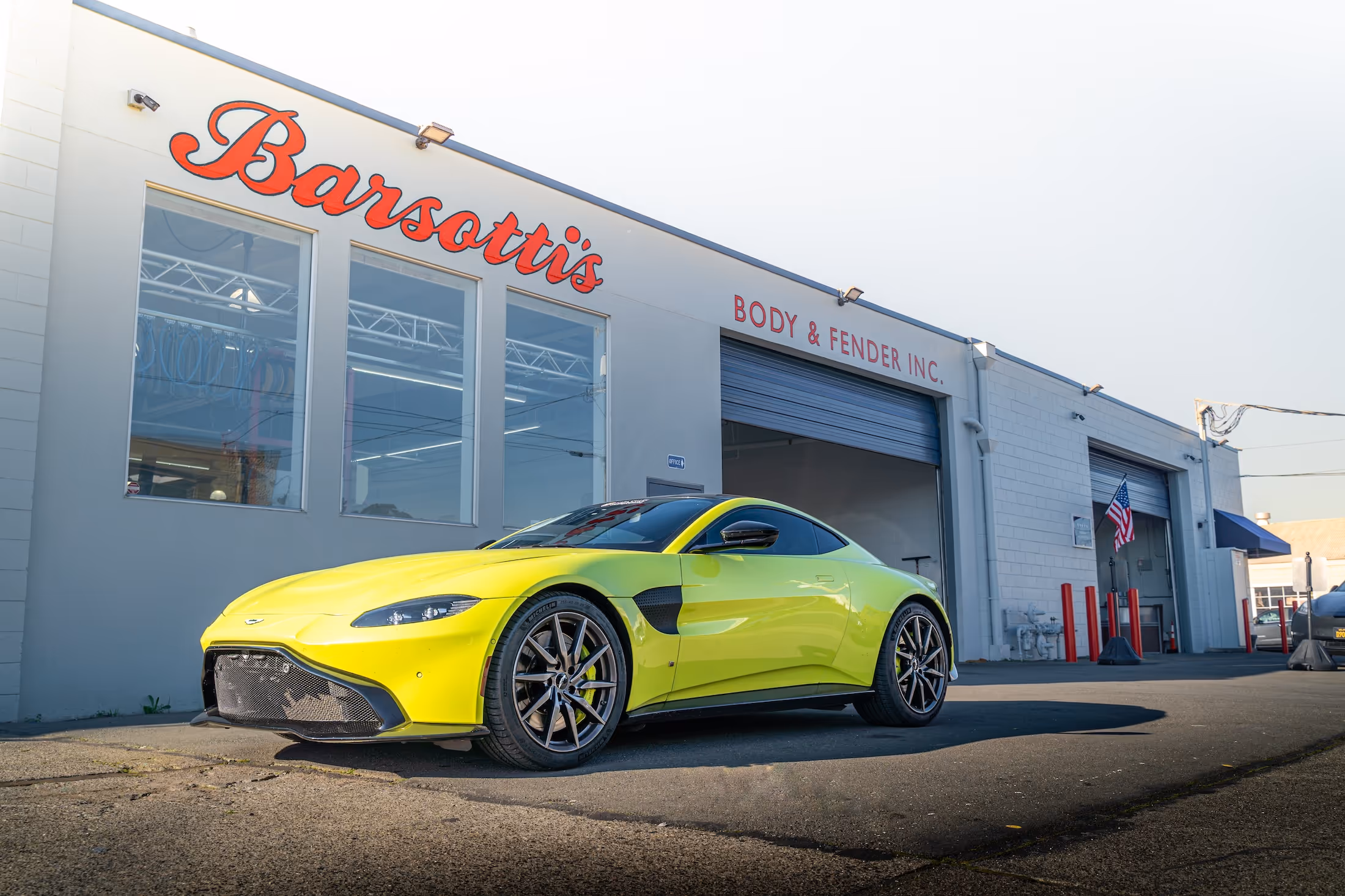 Chartreuse coupe parked in front of the Barsotti's Body and Fender shop.