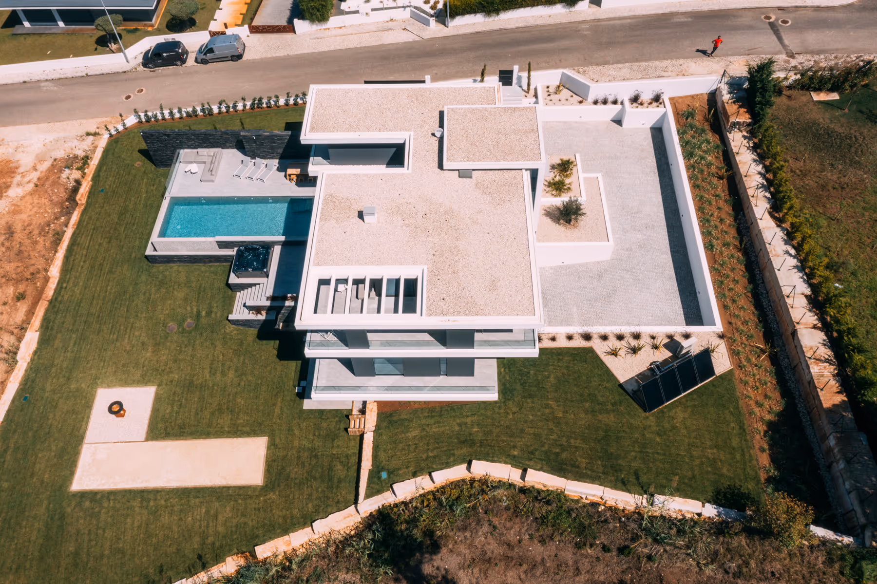 Sea Insight Villa exterior side elevation showing monumental scale and landscape integration