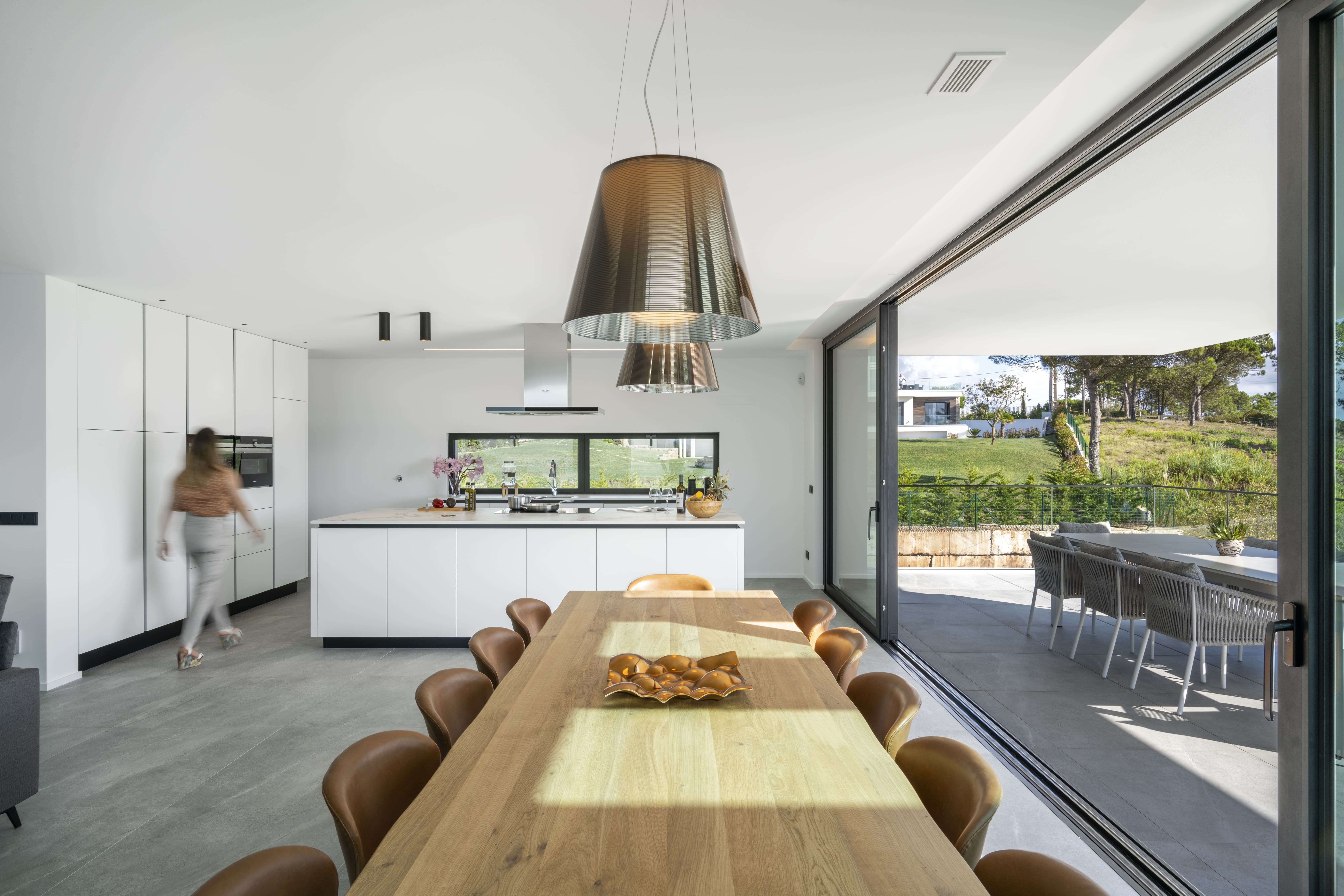 Sea Insight Villa interior hallway with noble materials and natural light flooding through glazing