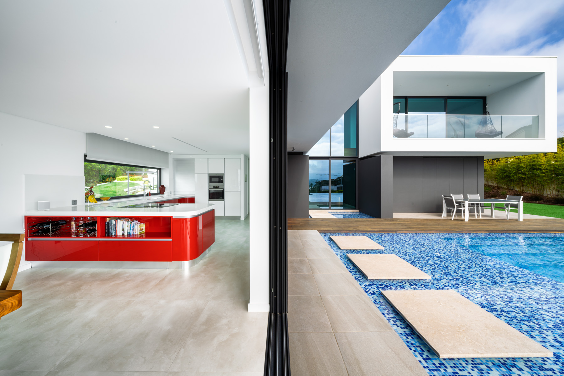 Ardonha Villa living room with large glass spans merging interior with Silver Coast beach views