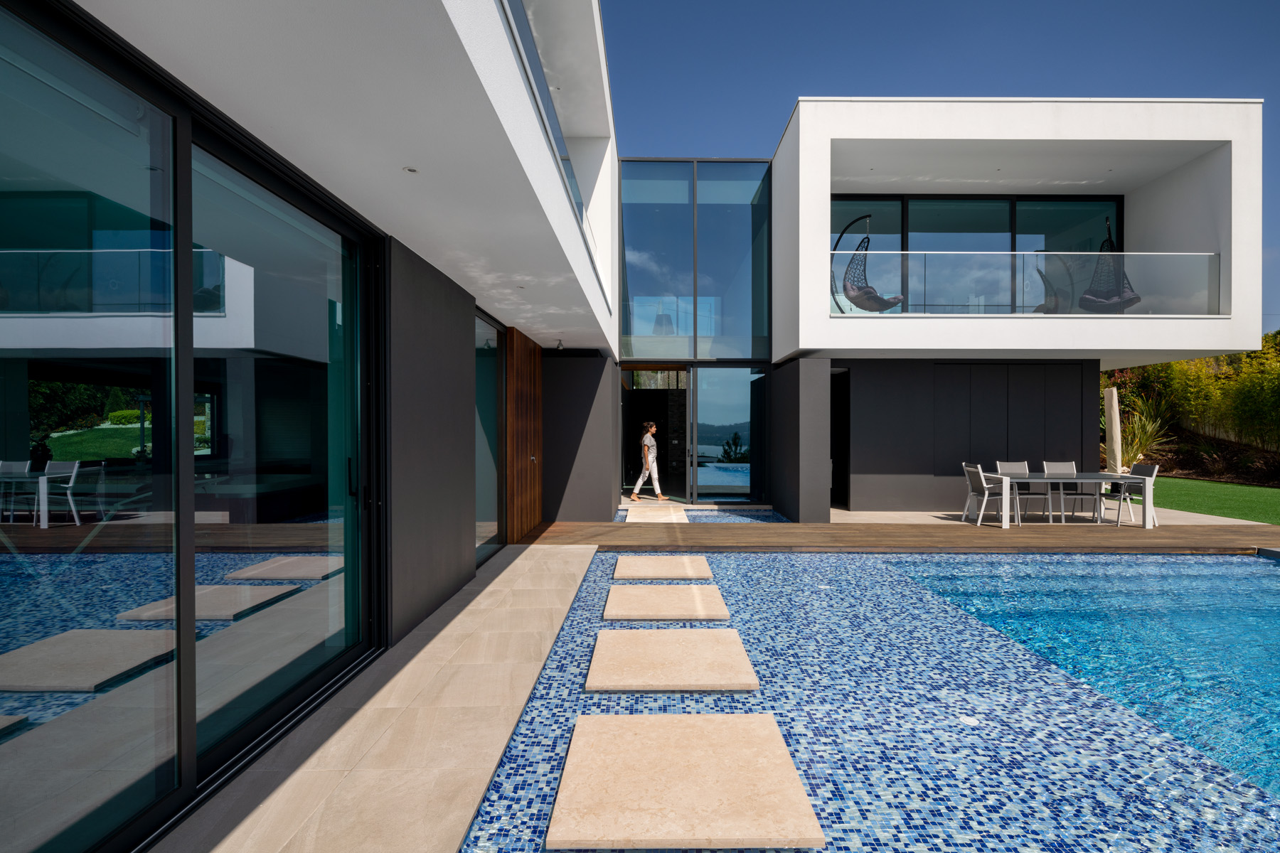 Ardonha Villa exterior concrete and stone cladding base anchoring the floating structure