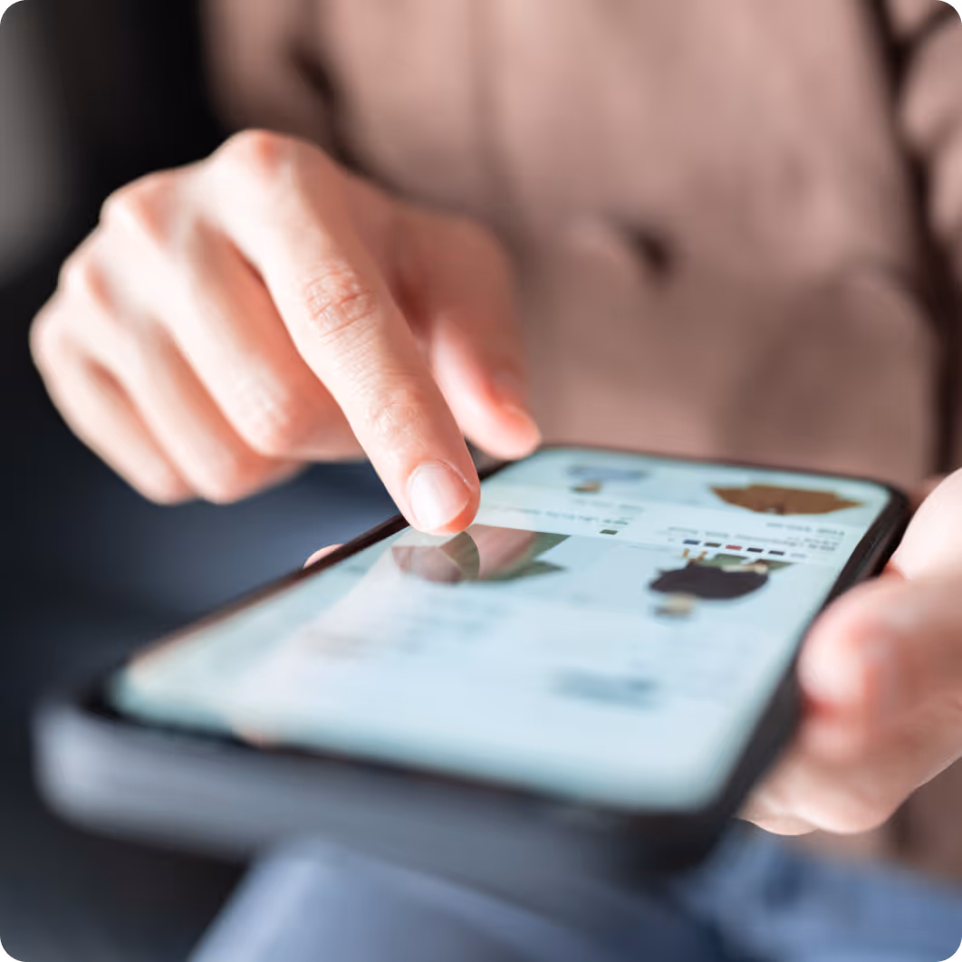 Person using a smartphone with their finger touching the screen