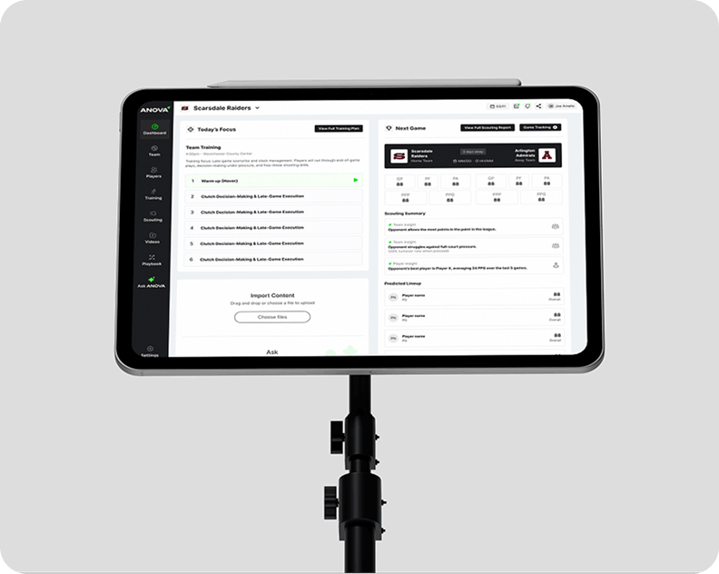Tablet displaying a sports management interface on a stand, showing team training details, game information, and scouting summaries; sleek and professional tone.