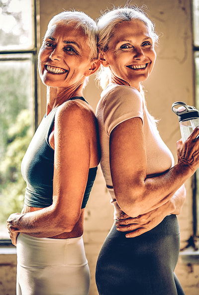 Retired women posing after a yoga session