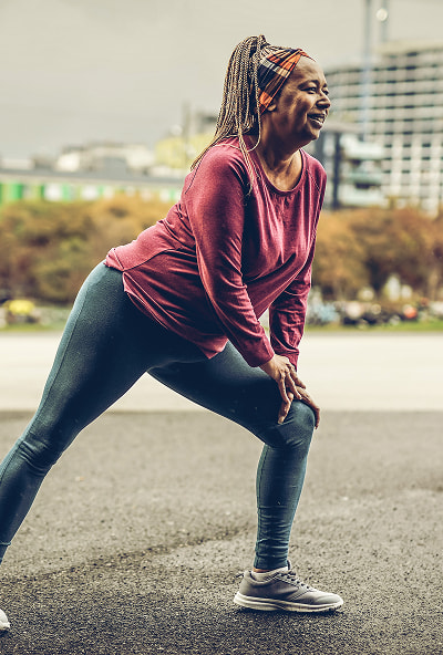 Retired Woman stretching before a run