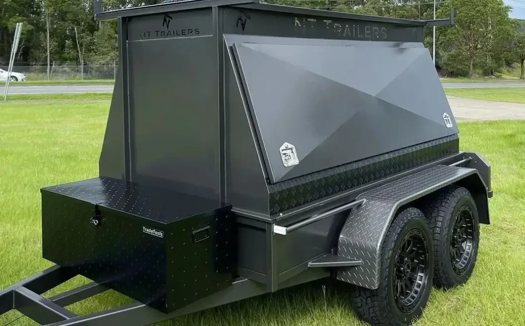 Professional builders trailer with reinforced storage, roof racks, and lockable doors