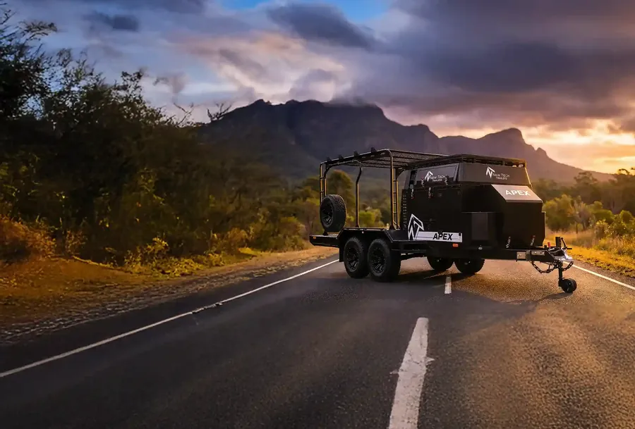 Apex toy hauler trailer on a mountain road