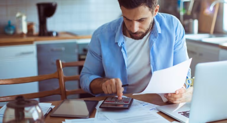 Person calculating his expenses