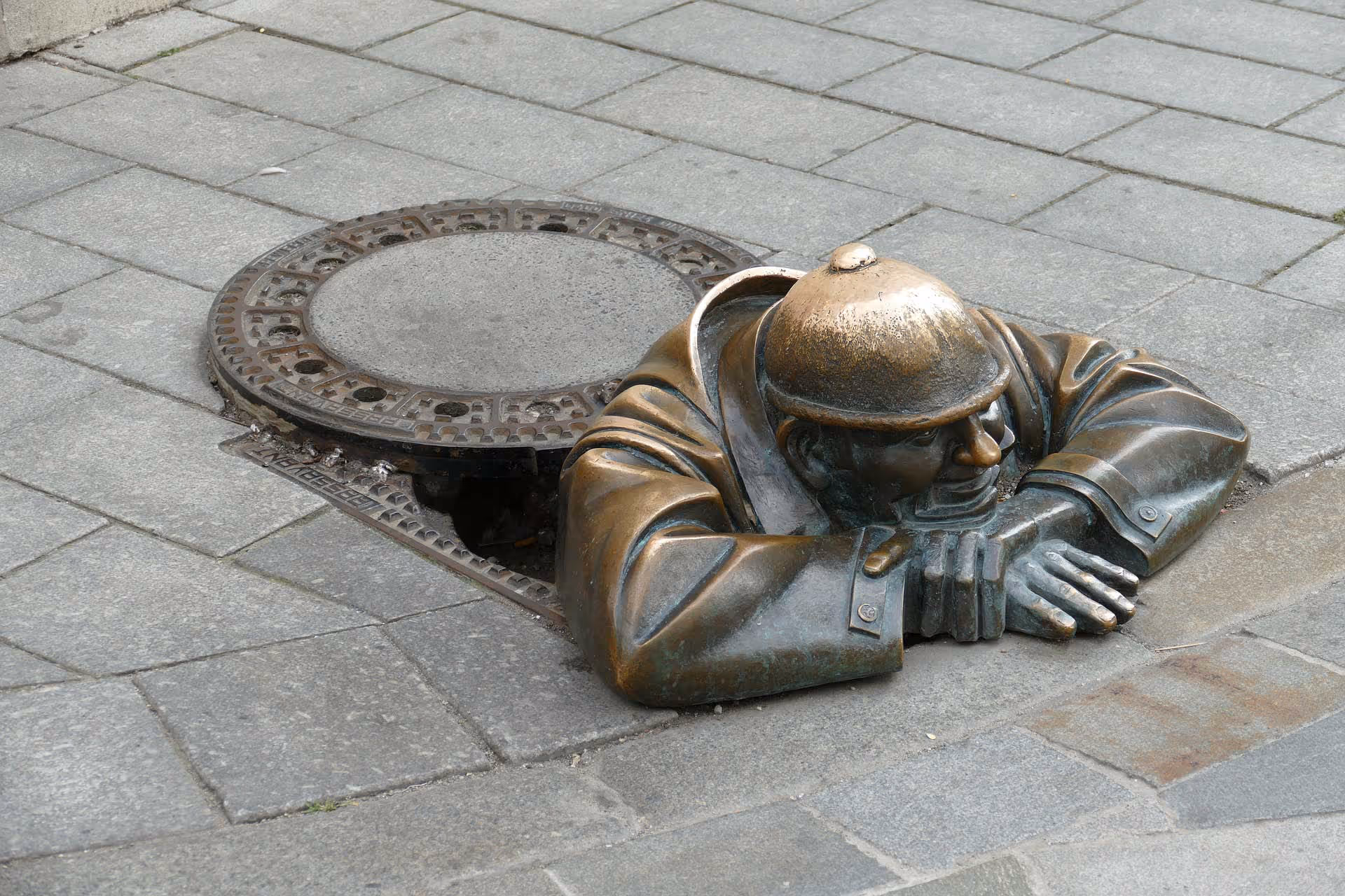 Bronze Statue in a manhole