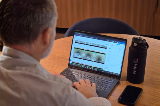 Abstract image with text: Exploring Manhole Inspection Technologies: From Remote Cameras to AI-Powered Condition Assessment