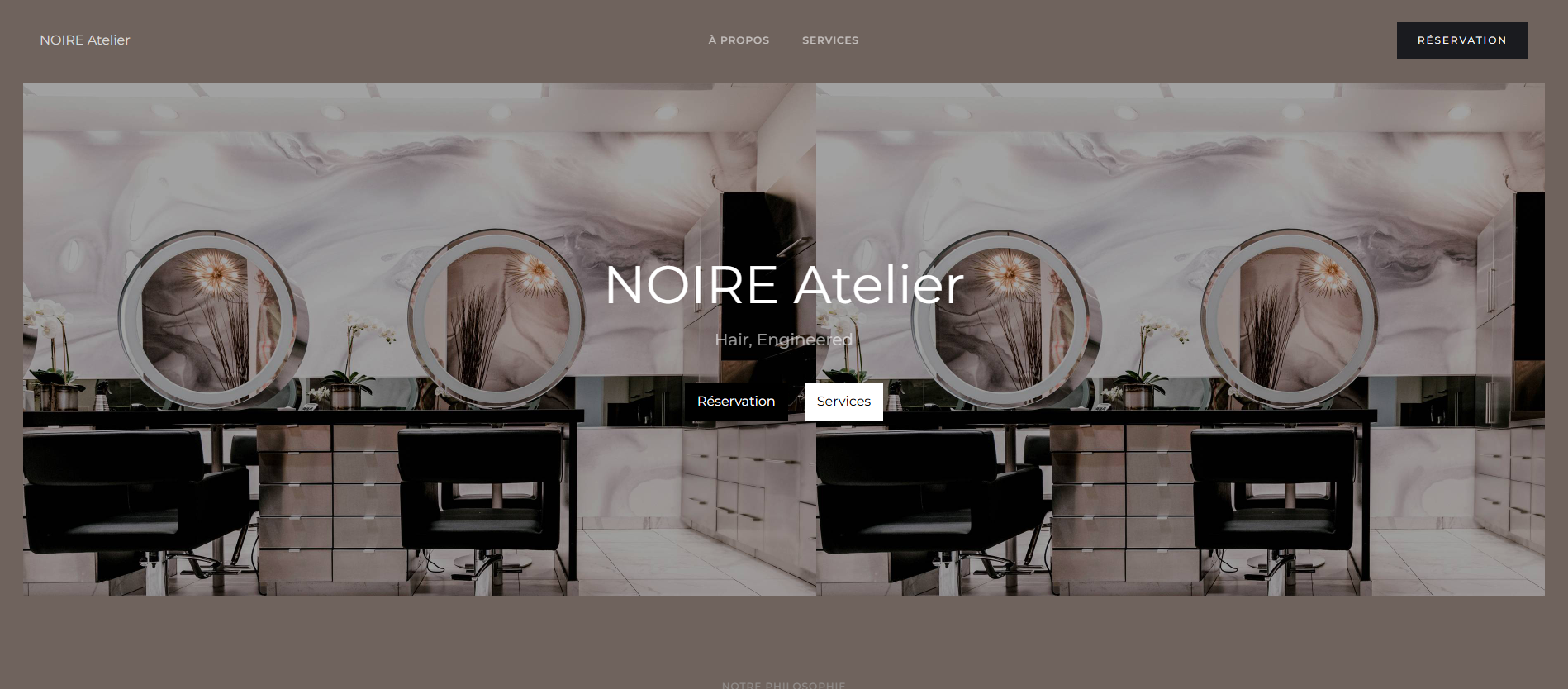 Luxury beauty salon interior designed by NOIRE Atelier with elegant black chairs and modern aesthetic