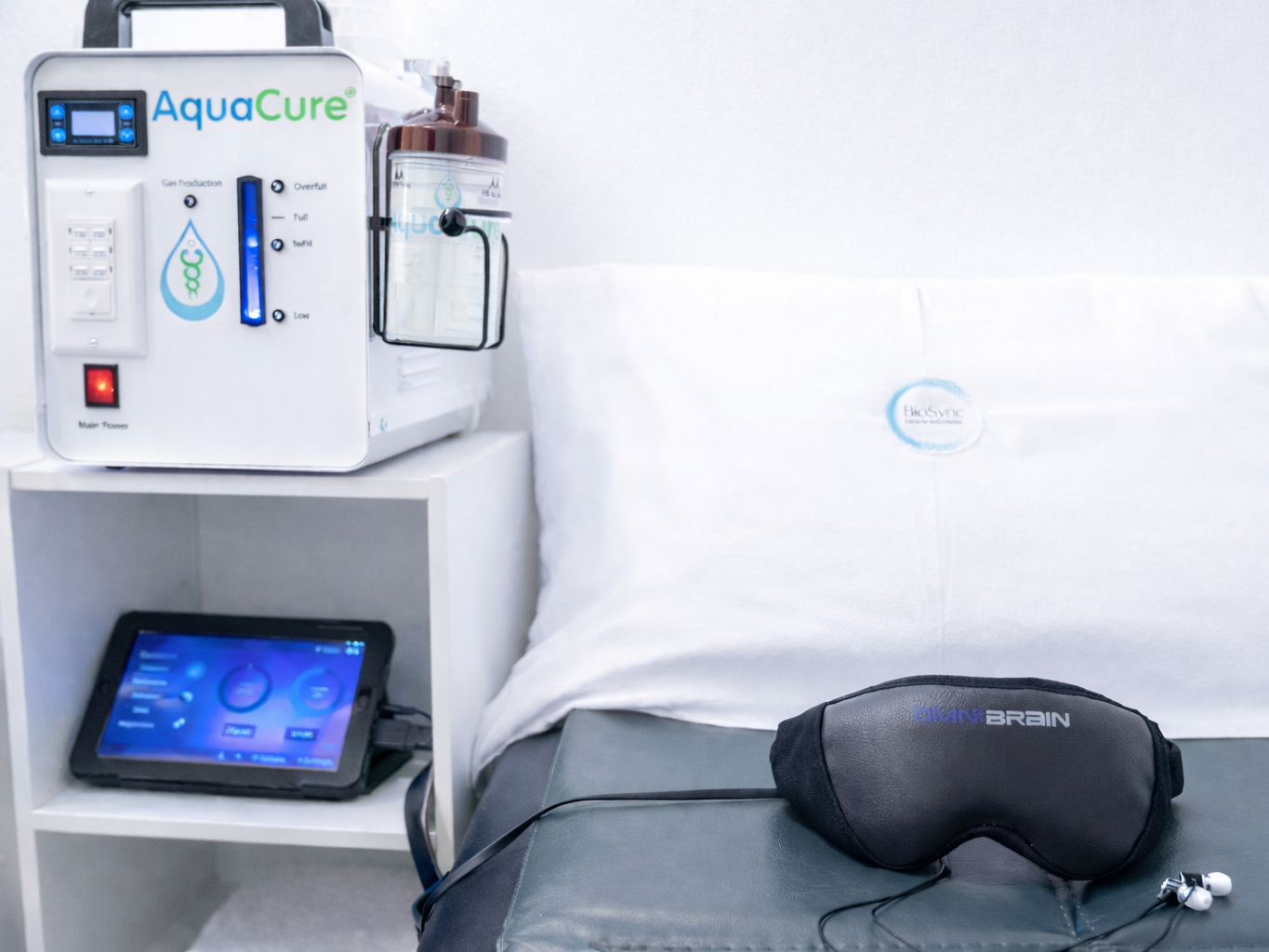 PEMF treatment room with Brown's Hydrogen gas machine. Pillow with audio and Brain goggles to rest with while laying on PEMF mat.