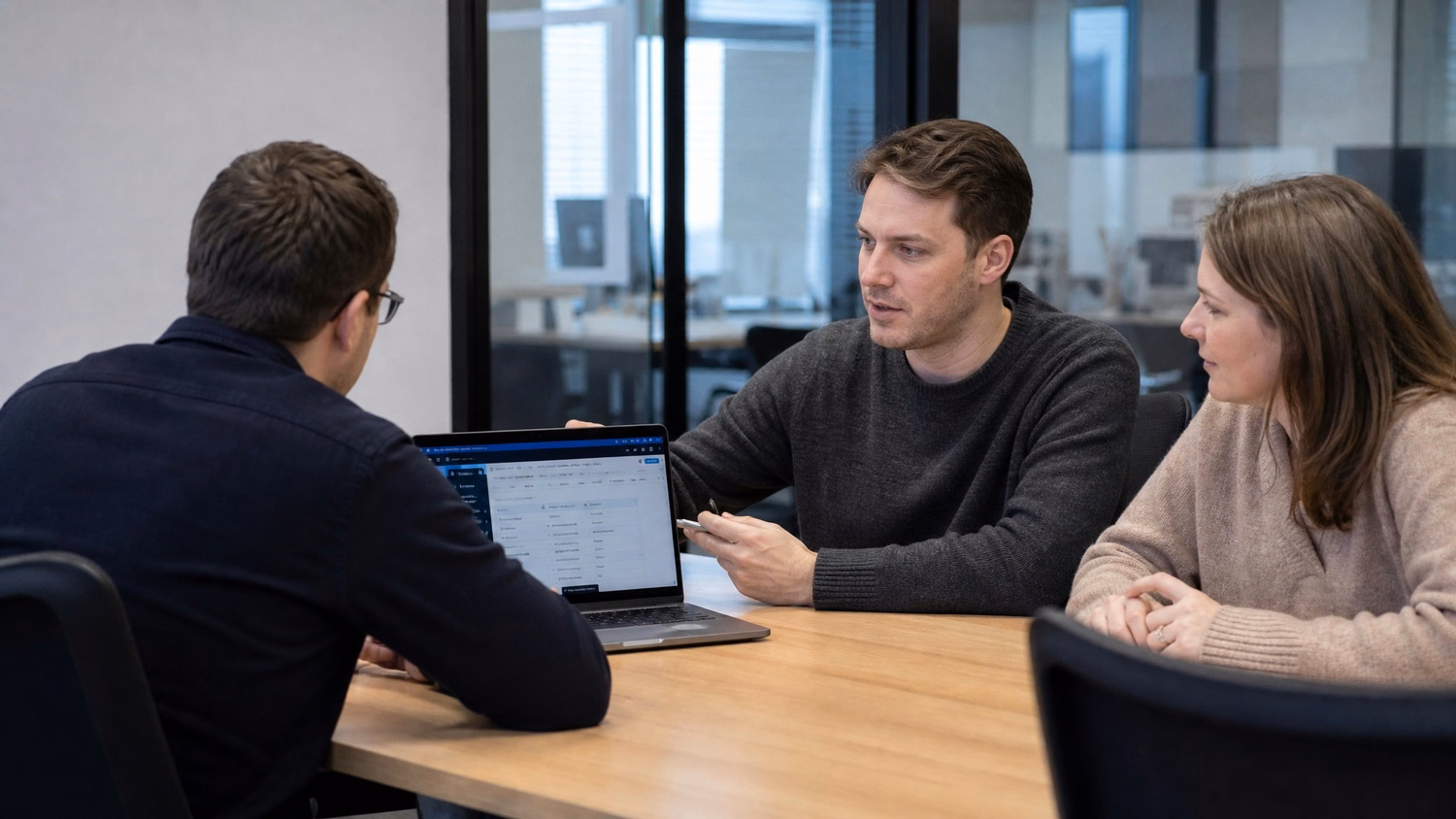 MEETING TABLE An IT professional two to four people seated around a meeting